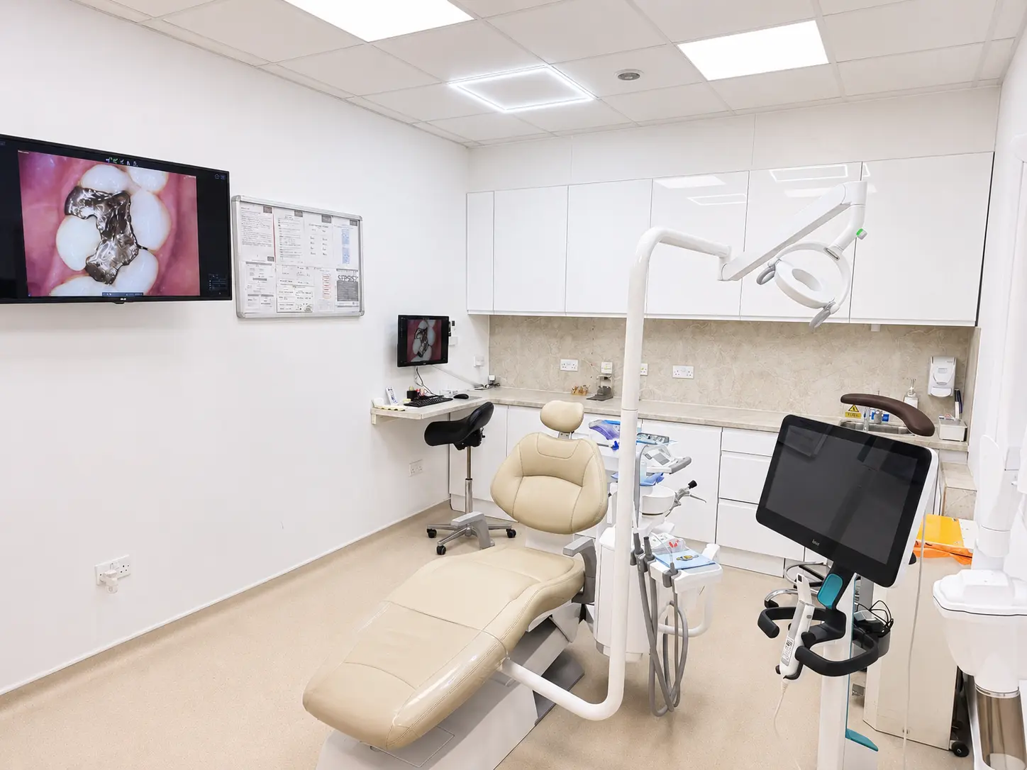 A treatment room at Brentford Health & Dental with a modern dental chair and digital equipment